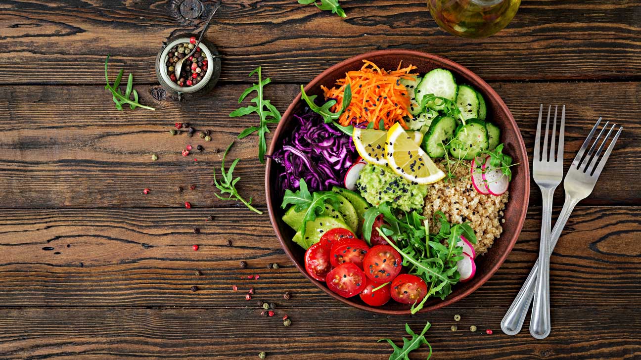Colorful vegetarian dishes with vegetables, grains, and legumes